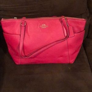 Pink and gold coach purse
